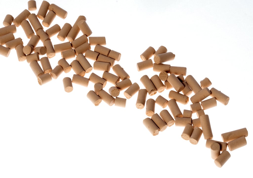 Cylindrical catalyst pellets used for chemical reaction and industrial process applications.